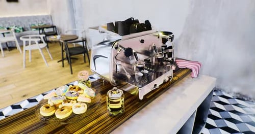 Realistic Coffee Machine Animation with Donuts in a Modern Cafe