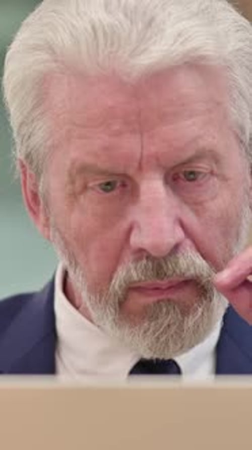 Close up of Senior Old Businessman using Laptop, Vertical Video