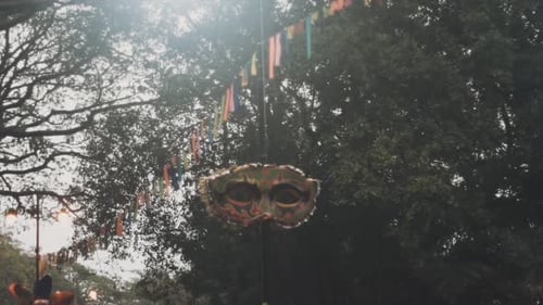 A festive display of hanging masks from India, celebrating its rich culture and traditions.