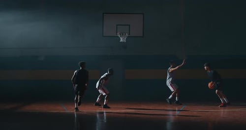 Men Practicing Basketball Plays in Indoor Gym