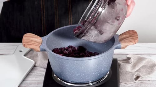 Making Berry Jam in Grey Pot