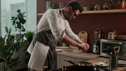 Chef Adding Thyme to Stir Fry Vegetables and Tossing Frying Pan while Cooking