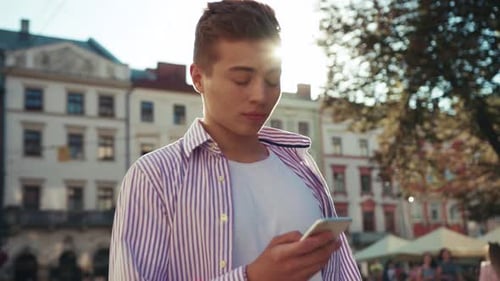 Happy Face Young Man Stand on Street Use Phone Look at Camera Sunlight Work Mobile Gadget Outside
