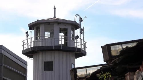 Prison watchtower seen from a distance.