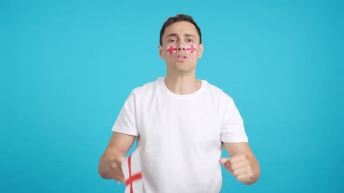 Excited Man Expressing Triumph and Disappointment with Flag