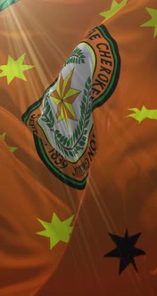Realistic Cherokee Nation Flag Waving in Wind with Sun Rays
