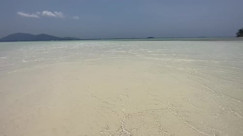 Tropical Island. View of small wave nice tropical empty sandy beach