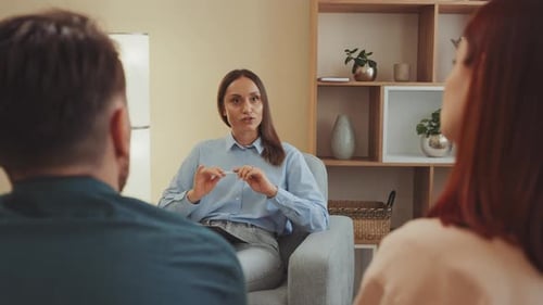 Counselor Talking with Couple in Therapy Session