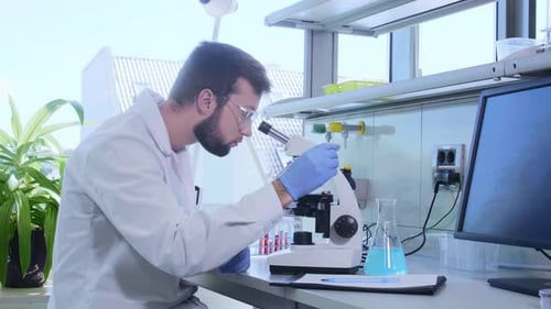 Scientist Using Microscope in Modern Laboratory