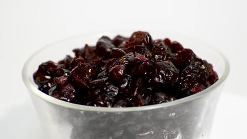 Close Up of Dried Cranberries in Glass Bowl