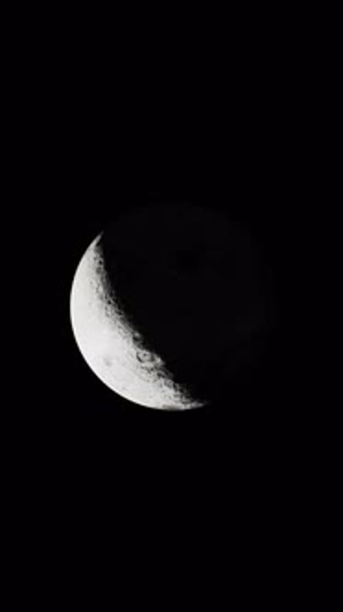 Sight of the Sundrenched Side of the Moon From a Distance Vertical