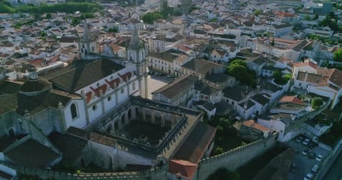 Aerial orbiting shot over Portalegre Cathedral revealing Historic Cityscape, Alentejo