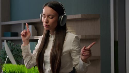 Caucasian Woman in Workplace Enjoying Sound in Wireless Headphones Smiling Happy Inspired Enjoy Song