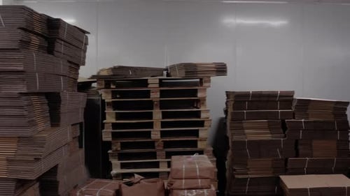 Stockpiled Cardboard and Boxes in an Indoor Warehouse
