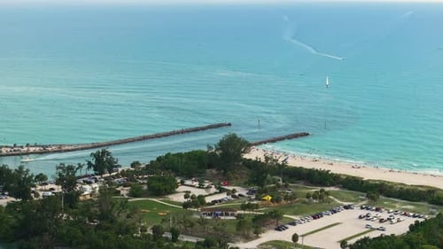 Aerial View of Sea Shore Near Venice Florida with White Yachts Floating on Sea Waves North and South