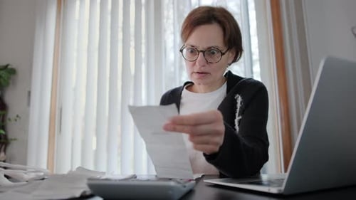 Woman Sit at Workplace Desk Feels Frustrated Concerned Due High Taxes Loan Debt Dismissal Staff Cuts