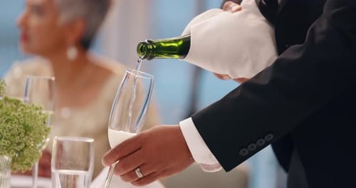 Champagne glass, waiter and hands of person pour liquid at social event