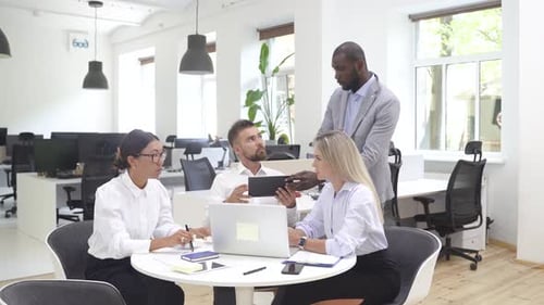 Multiethnic Business People During Meeting in Modern Office