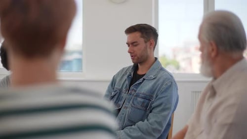 Side View of Depressed Pensive Man Telling About Mental Problem or Addiction to Other Patients