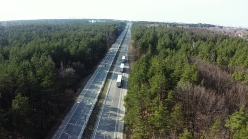 Road transport truck industry. highway top view follow vehicle aerial footage.