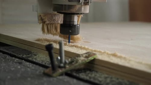 Cutting Parts From Plywood Using an Automatic Drilling Knife in the Workshop