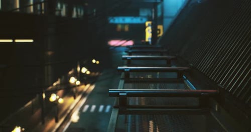 Nighttime Urban View Showcasing a Quiet Street and Illuminated Buildings