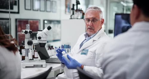 Scientist Working in Lab Wearing Gloves