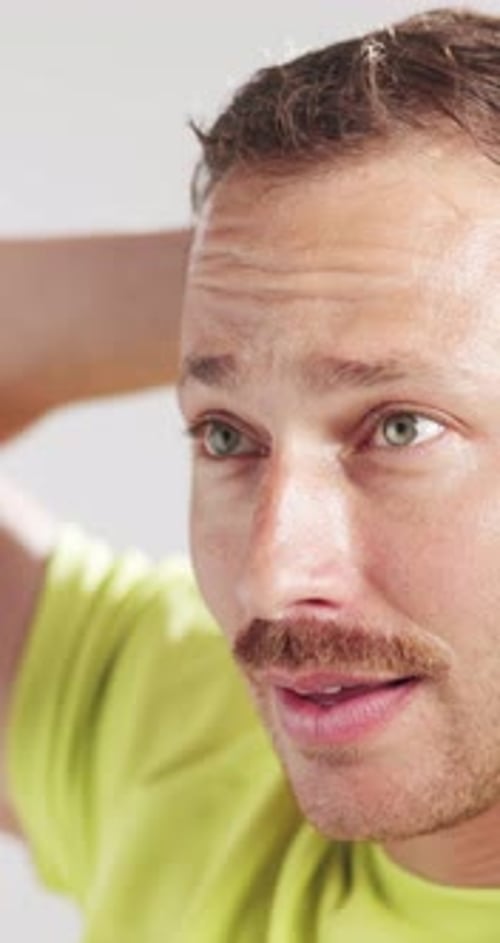 Fitness, fatigue or man thinking in studio with workout rest, cool down or introspection for goal