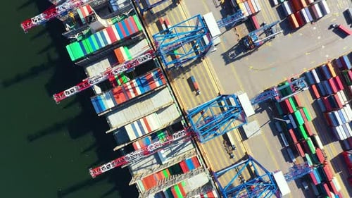 Container ship loading at port with crane, container ship carrying container import and export busin