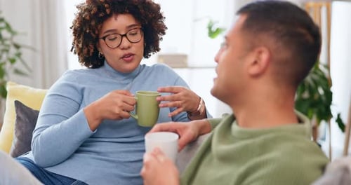 Couple Conversing and Relaxing with Coffee at Home