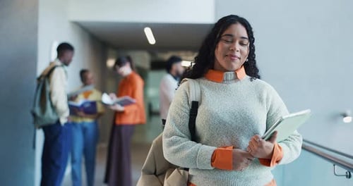 Happy, college and face of woman in hallway ready for learning, education and knowledge