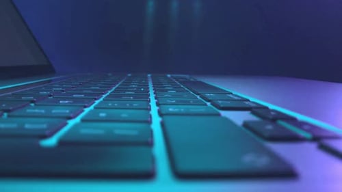 Laptop keyboard glowing blue