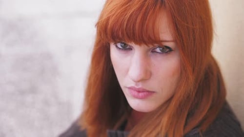 Red Haired Woman Looking Upward in a Close Up