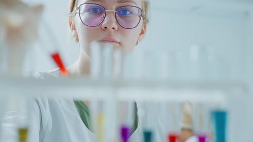 Medical Research Laboratory Portrait of Female Scientist Working with Samples Using Micro Pipette