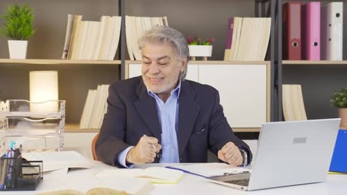 Excited Man Working in Bright Office Setting