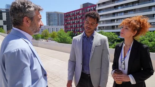 Professional Business Team Shaking Hands Outdoors