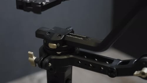 Adjusting Black Metal Camera Rig Close Up