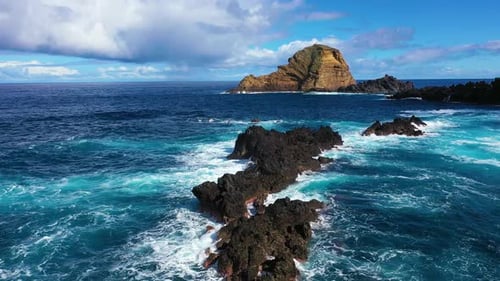 Waves and rocks of the Atlantic Ocean. Beautiful seascape. Drone video of water. Coast and cliffs