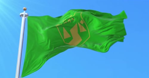 Green Flag of Vranje Waving in Blue Sky
