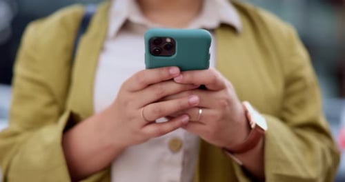 Hands, cellphone and typing in city, social media or texting outdoor in urban street