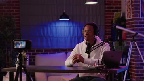 Man Recording Live Broadcast in Home Studio