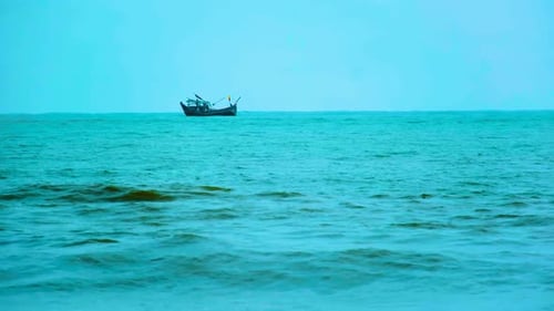 Isolated Fishing Trawler Boat In The Indian Ocean With Moody Weather Near Kuakata Beach, Bangladesh.