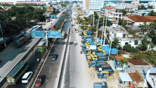 Aerial shot of a busy road where vehicles are passing in Dhaka, Bangladesh