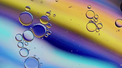 Colorful Oil Bubbles Moving On A Water Surface 044