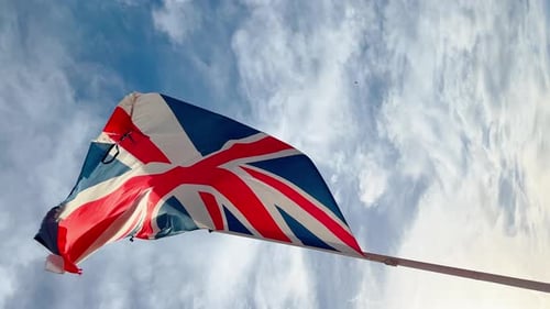 Worn United Kingdom Flag Waves in the Wind