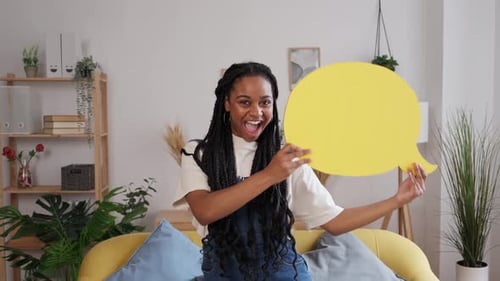 African American Woman Holding Yellow Text Cloud