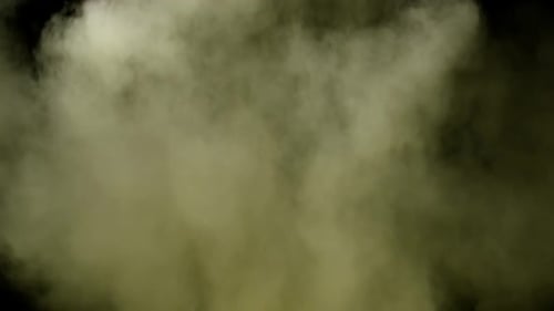 Collider Collection: Yellow colored powder lingering on a black background