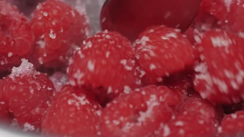 Raspberries with Sugar Being Stirred in Bowl