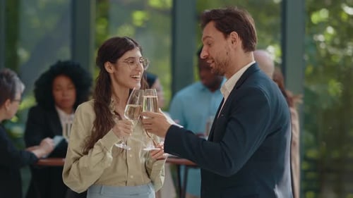 Adults Socialize with Champagne at Corporate Networking Event