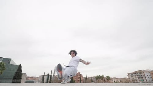 Young Adult Breakdancing in Urban Environment